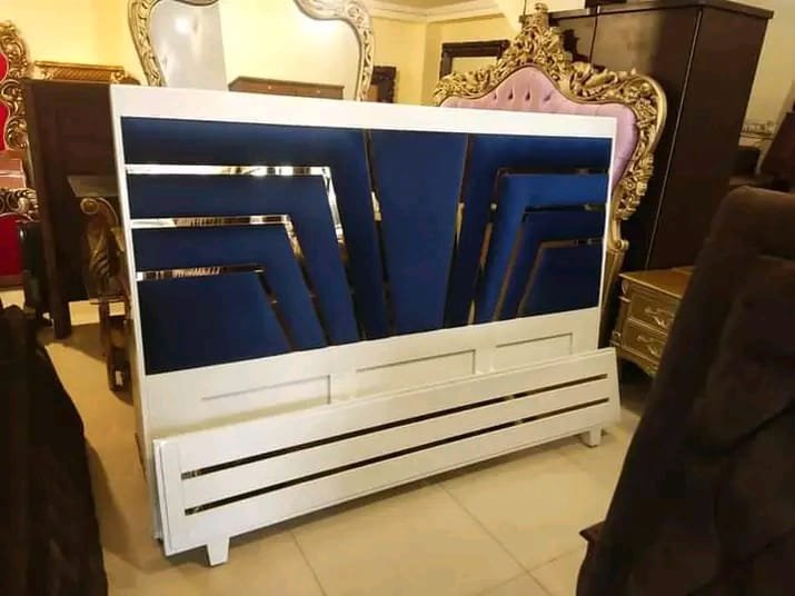 “Luxury modern furniture showroom with sophisticated seating and warm lighting.”